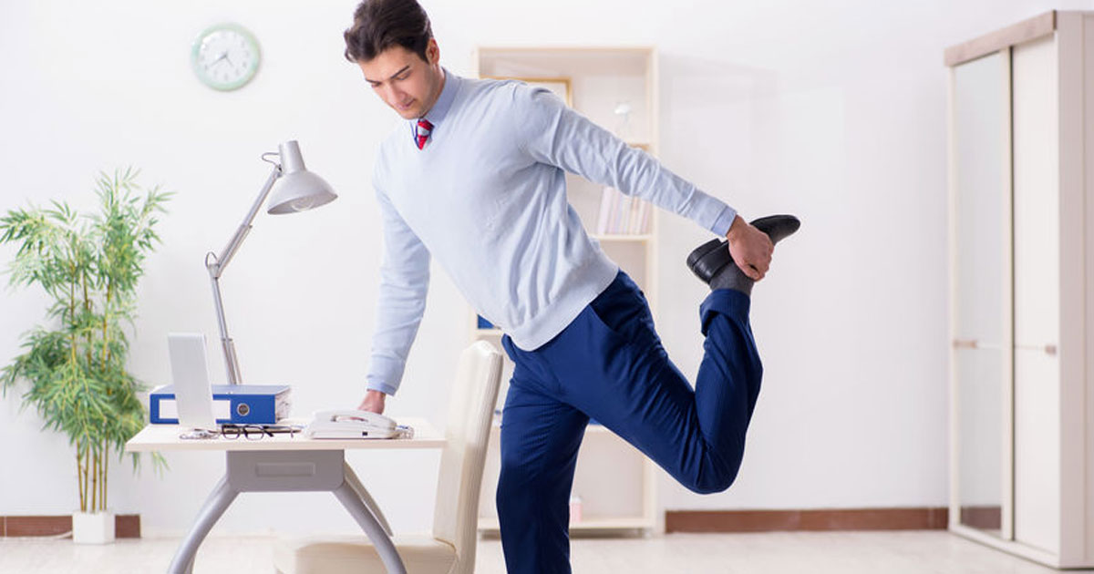 Man stretching before starting to sell insurance