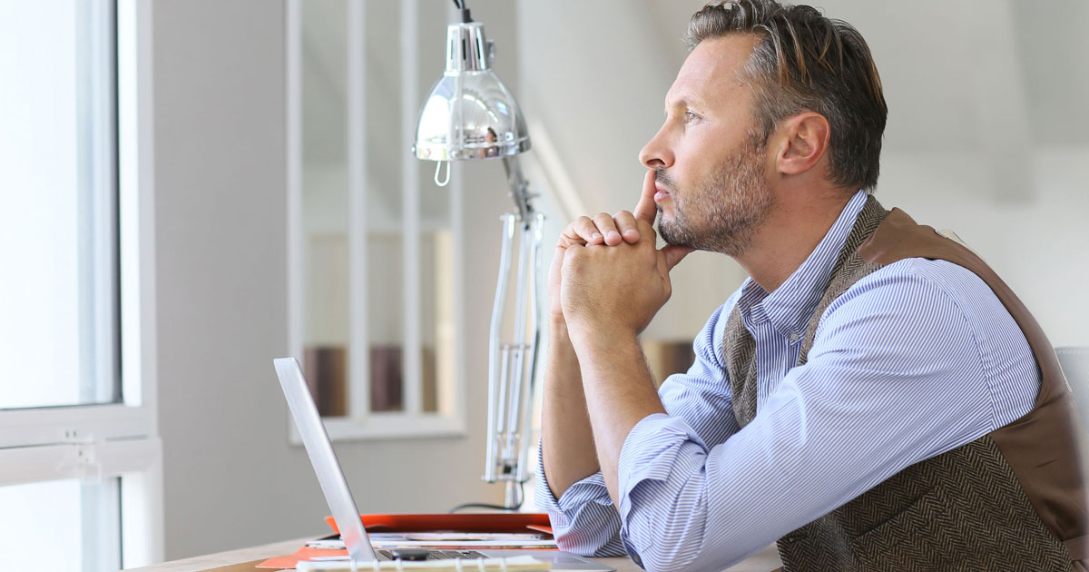 Insurance agent thinking about how to sell insurance over the phone
